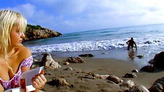 Blond woman fucks an unknown man on the beach