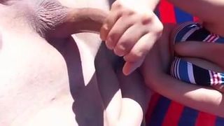 Couple beach handjob