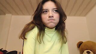 Girl with an innocent face sucks his fingers in a suggestive way