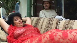 MILF with huge breasts rides a big cock outside