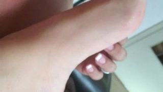 A woman licks my feet