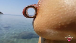 nippleringlover – horny milf pissing on the nude beach, pierced pussy, wide open, huge pierced nipples