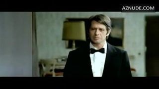 D. Haddon in 1975 movie in black satin bikini panty