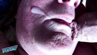 Her mouth gets filled with cum and she swallows