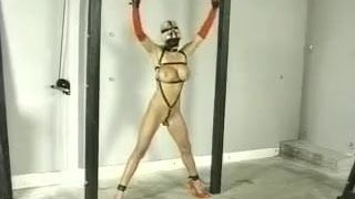 Punishment of Blonde Slave Restrained in Harness and Ropes