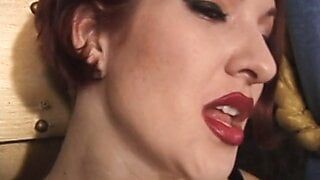 Wild leather doms with sexy red lipstick pinch and suck