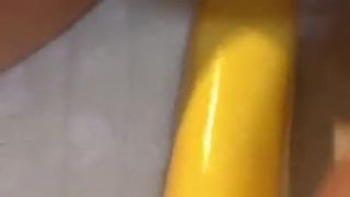 A woman doctor playing with banana