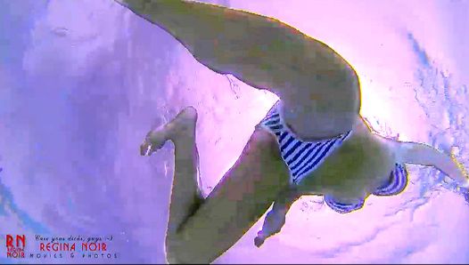 Amazing underwater bikini show. Elegant flexible babe swims