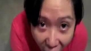 Slanty Eyed Asian Drinking Stranger’s Cum