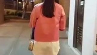 Asian woman walking alone