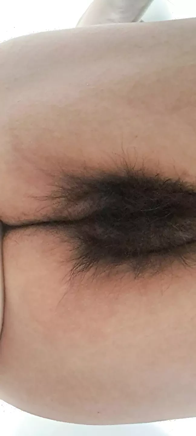 Mature milf’s fat, open, hairy pussy seen from below