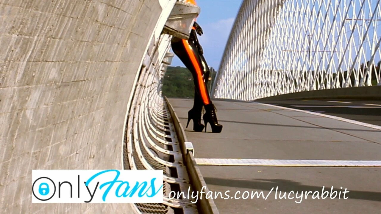 Backstage from photoshoot – black and orange latex in public