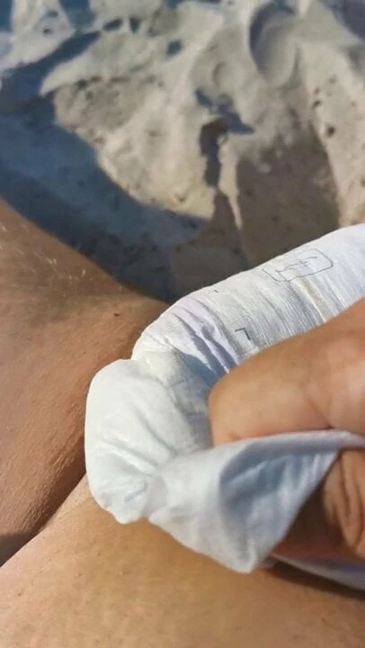 Diaper on public beach and masturbation