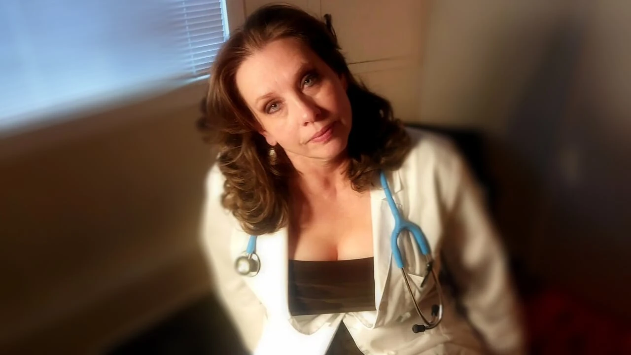 A Sexy Mature MILF Doctor Examines A Young Man And His Curved Cock And Gives Him An Anatomy Lesson He’ll Never Forget