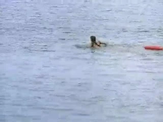 Carmen Electra in a red swimsuit