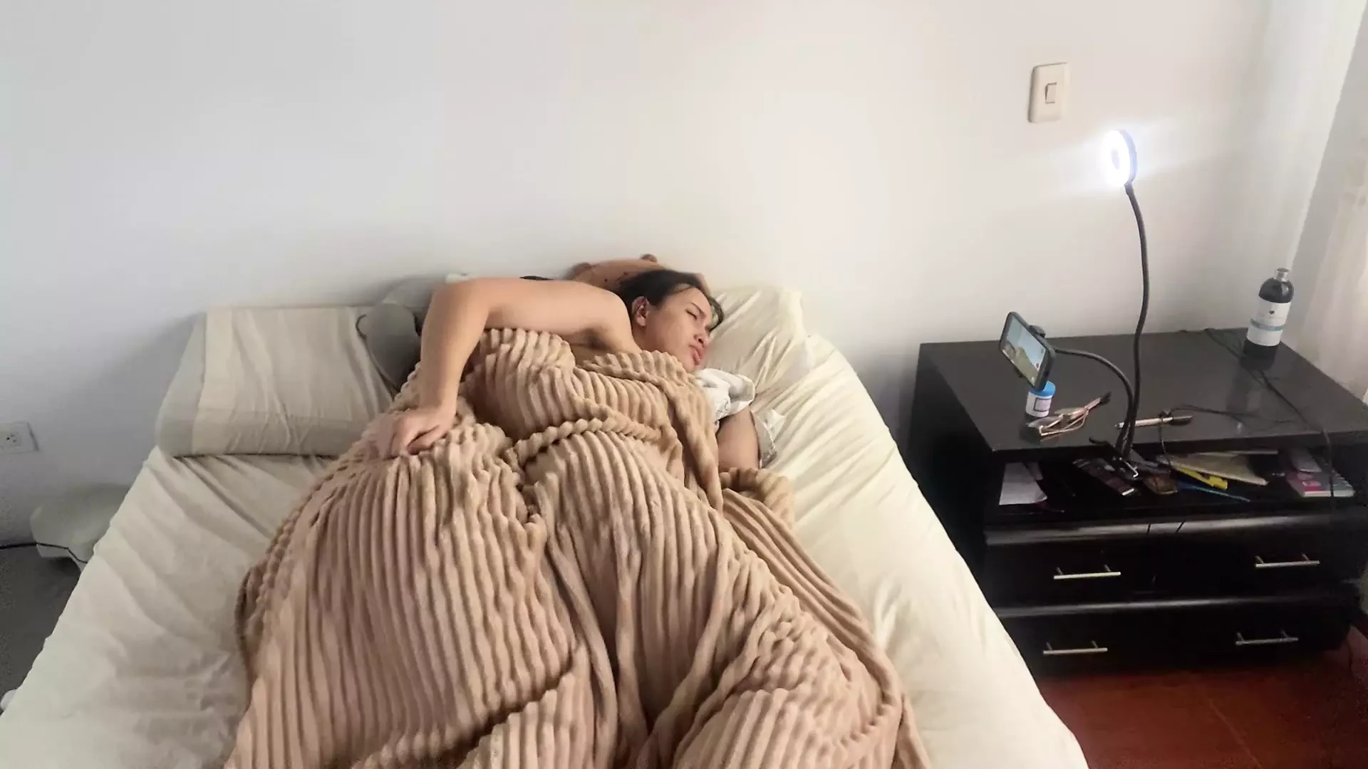 Lesbian sex under the covers on a cold morning