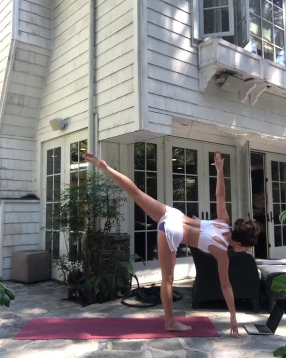 Kate Beckinsale doing yoga outdoors
