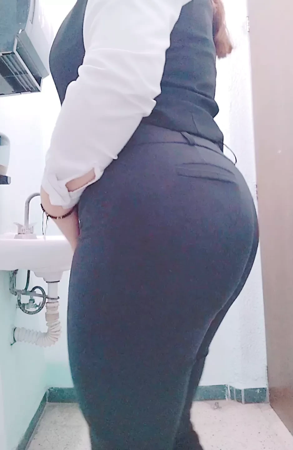 Sexy Mexican MILF secretary with a big butt takes off her uniform at the office and shows her nice and sensual ass