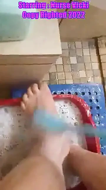 Scrubbing my big feet and legs with a brush