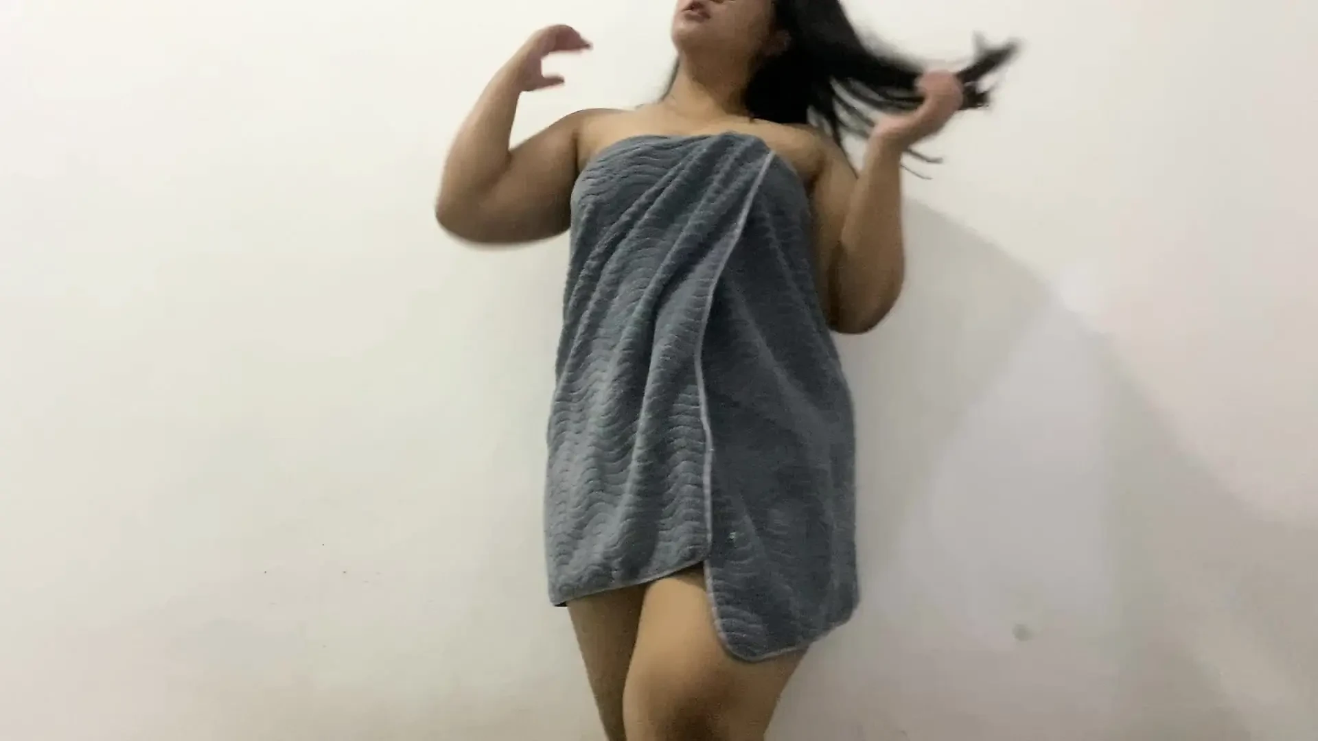 Beautiful girl who is having fun playing with her genitals to her own satisfaction